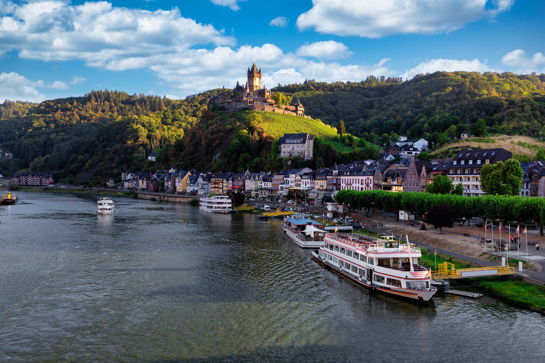 Riverboats moored below Cochem and its hilltop castle on the Moselle